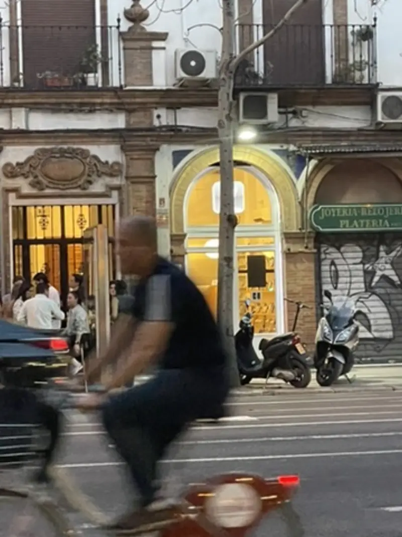 Amit Bhardwaj iRepair at night — urban view with the shop lit up